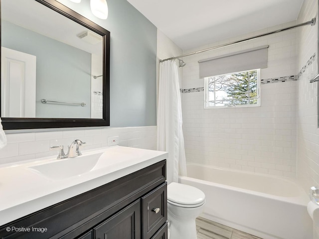 504 S Pierce Ave, Wheaton, IL 60187 - full bath with vanity, shower / bathtub combination with curtain, and tile walls