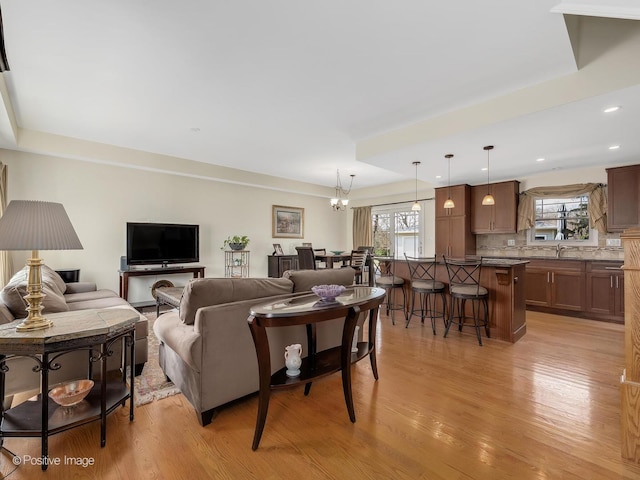 504 S Pierce Ave, Wheaton, IL 60187 - living room with light wood-style floors, healthy amount of natural light, a chandelier, and recessed lighting