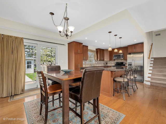 504 S Pierce Ave, Wheaton, IL 60187 - dining space featuring plenty of natural light, stairs, a chandelier, light wood-style flooring, and recessed lighting