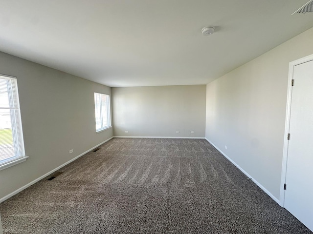 6604 Pasture Side Trl, Matteson, IL 60443 - spare room featuring baseboards, dark colored carpet, and visible vents