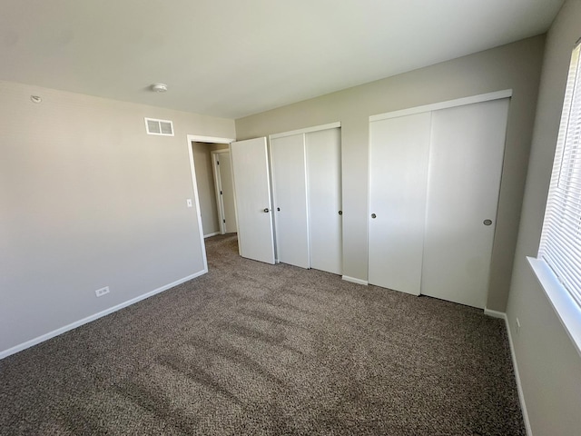6604 Pasture Side Trl, Matteson, IL 60443 - unfurnished bedroom with two closets, carpet, baseboards, and visible vents
