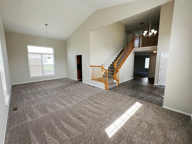 6604 Pasture Side Trl, Matteson, IL 60443 - unfurnished living room featuring carpet, baseboards, stairs, a chandelier, and high vaulted ceiling