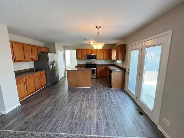 6604 Pasture Side Trl, Matteson, IL 60443 - kitchen featuring a sink, stainless steel appliances, dark countertops, and a healthy amount of sunlight