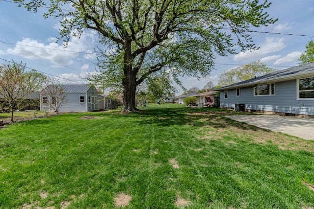 view of yard with central AC