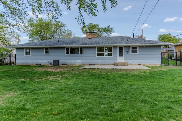 back of property featuring a patio area, cooling unit, and a chimney