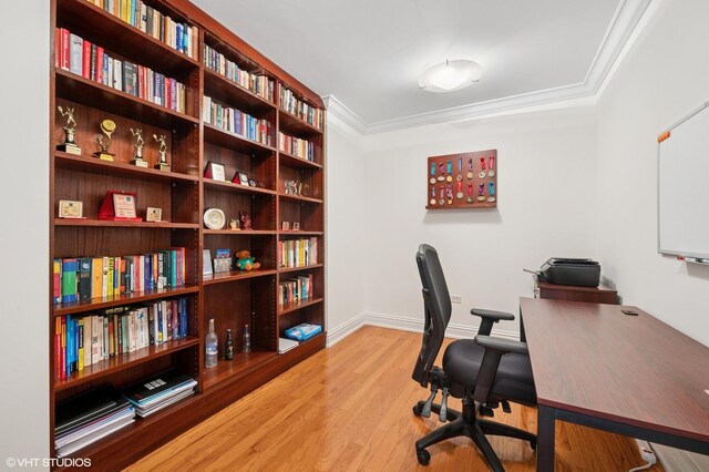 home office featuring ornamental molding, light wood-style floors, and baseboards