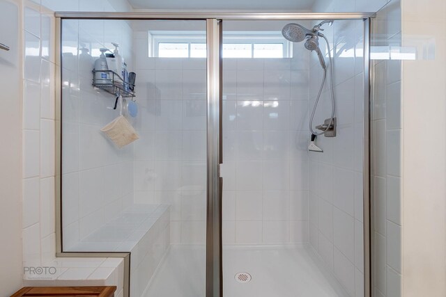 bathroom with a shower stall