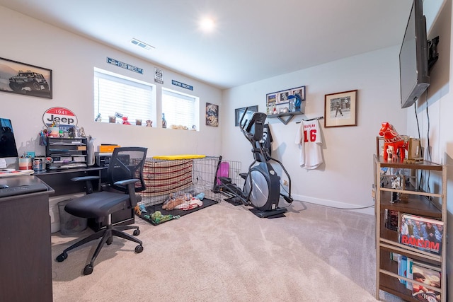 carpeted office space with baseboards and visible vents