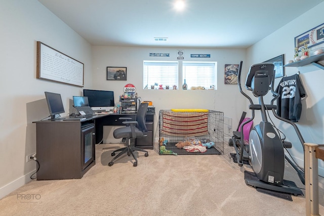 carpeted office with baseboards and visible vents