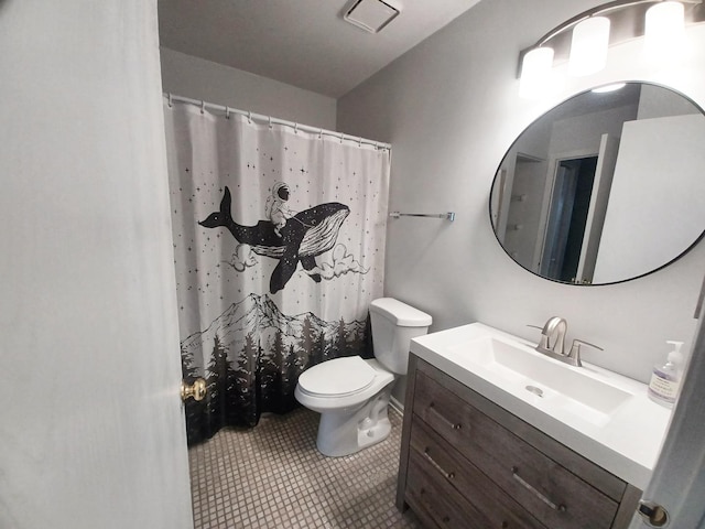 bathroom with vanity, toilet, tile patterned flooring, and a shower with curtain