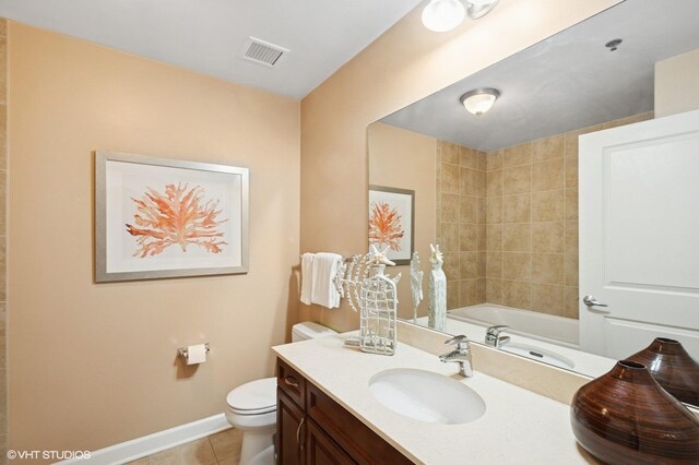 full bath featuring tile patterned flooring, toilet, vanity, and baseboards