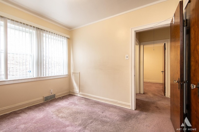 10041 S Calumet Ave, Chicago, IL 60628 - unfurnished room featuring carpet, crown molding, and baseboards