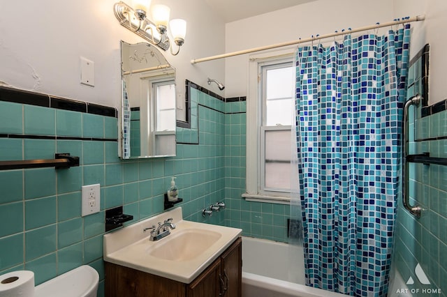 10041 S Calumet Ave, Chicago, IL 60628 - bathroom featuring tile walls, toilet, shower / tub combo, and vanity