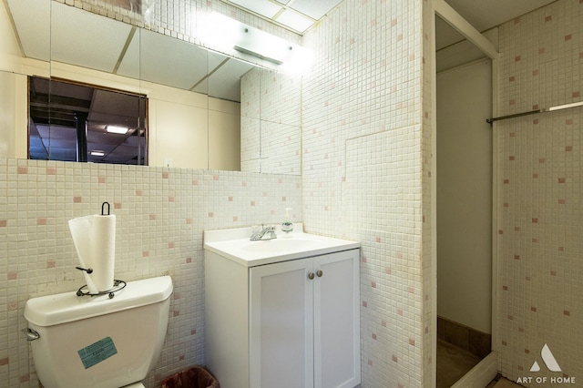 10041 S Calumet Ave, Chicago, IL 60628 - full bath featuring tile walls, vanity, a shower stall, and toilet
