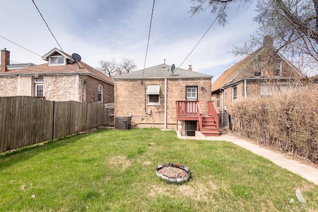 10041 S Calumet Ave, Chicago, IL 60628 - back of property with brick siding and central AC unit