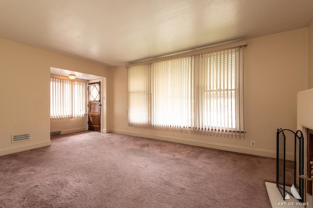 10041 S Calumet Ave, Chicago, IL 60628 - unfurnished living room featuring carpet flooring and baseboards