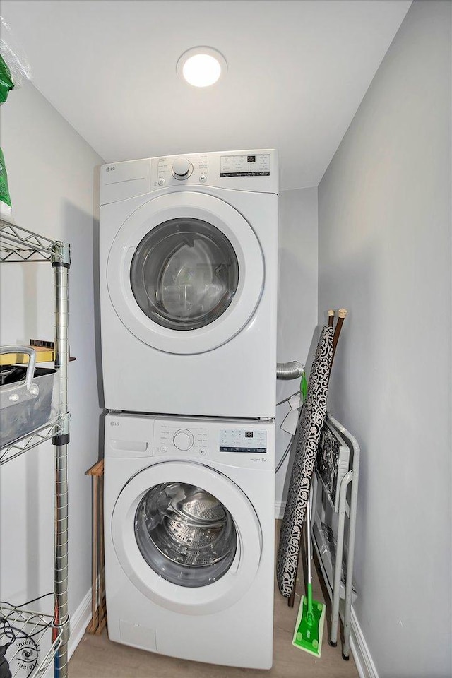 3530 S Union Ave, Chicago, IL 60609 - laundry area featuring laundry area, stacked washing maching and dryer, and wood finished floors