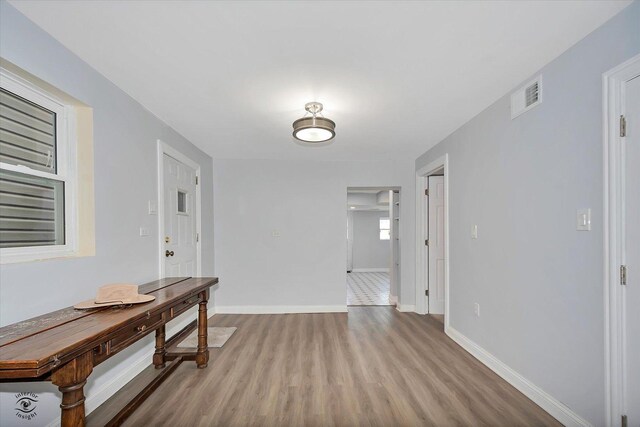 3530 S Union Ave, Chicago, IL 60609 - hallway with baseboards, visible vents, and wood finished floors