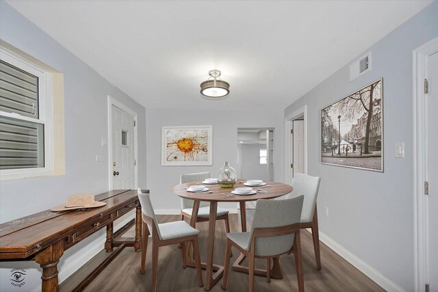 3530 S Union Ave, Chicago, IL 60609 - dining room featuring baseboards, visible vents, and wood finished floors