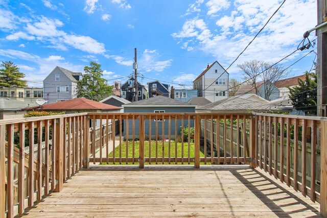 wooden terrace with a residential view