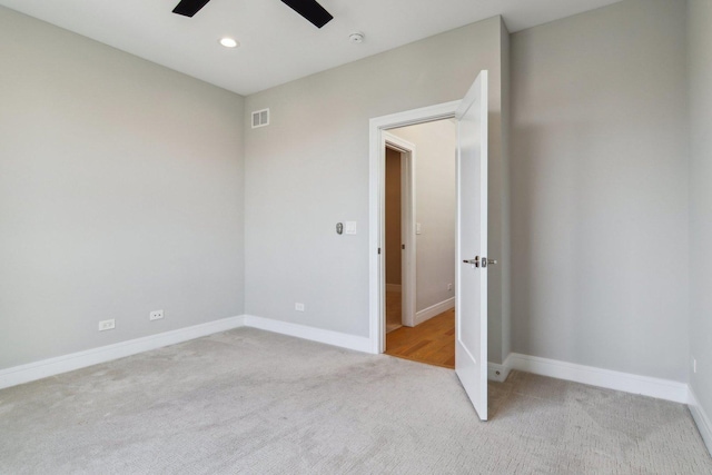 unfurnished bedroom with light carpet, baseboards, recessed lighting, and ceiling fan