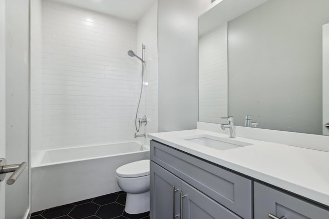 full bathroom featuring toilet, vanity, tile patterned floors, and tub / shower combination