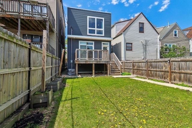 back of property with a deck and stairway