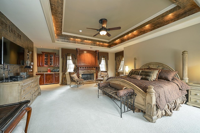 305 S Wright St, Naperville, IL 60540 - bedroom with light colored carpet, a fireplace, crown molding, a ceiling fan, and a tray ceiling