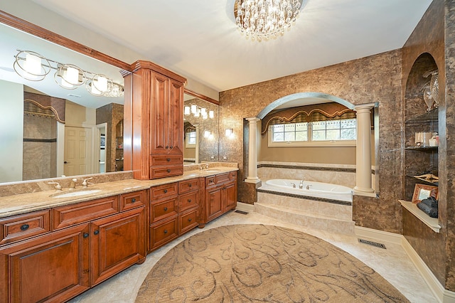305 S Wright St, Naperville, IL 60540 - bathroom featuring a bath, a sink, double vanity, and decorative columns