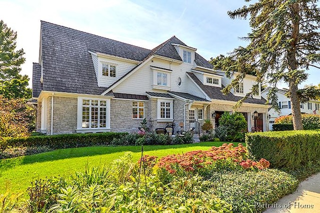 305 S Wright St, Naperville, IL 60540 - view of front of house featuring stone siding, a standing seam roof, and a front lawn