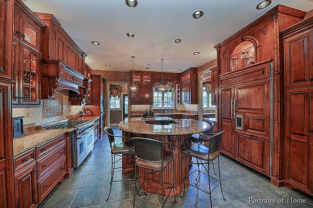 305 S Wright St, Naperville, IL 60540 - kitchen featuring recessed lighting, double oven range, a kitchen bar, a kitchen island, and tasteful backsplash