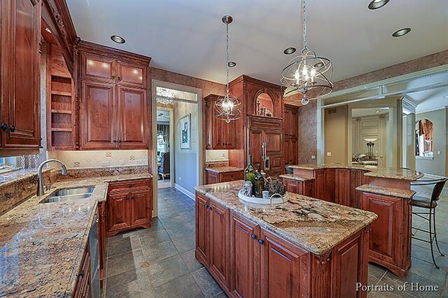 305 S Wright St, Naperville, IL 60540 - kitchen featuring a center island with sink, a chandelier, recessed lighting, and a sink