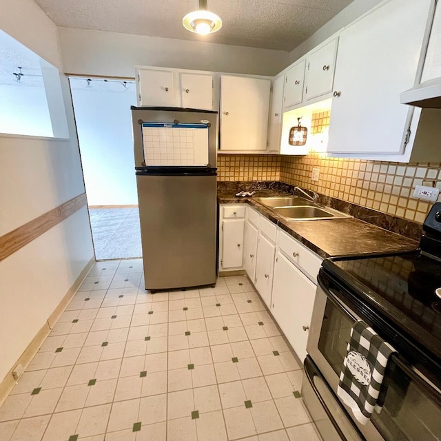 9701 N Dee Rd Unit 4C, Niles, IL 60714 - kitchen featuring stainless steel appliances, dark countertops, a sink, backsplash, and white cabinets