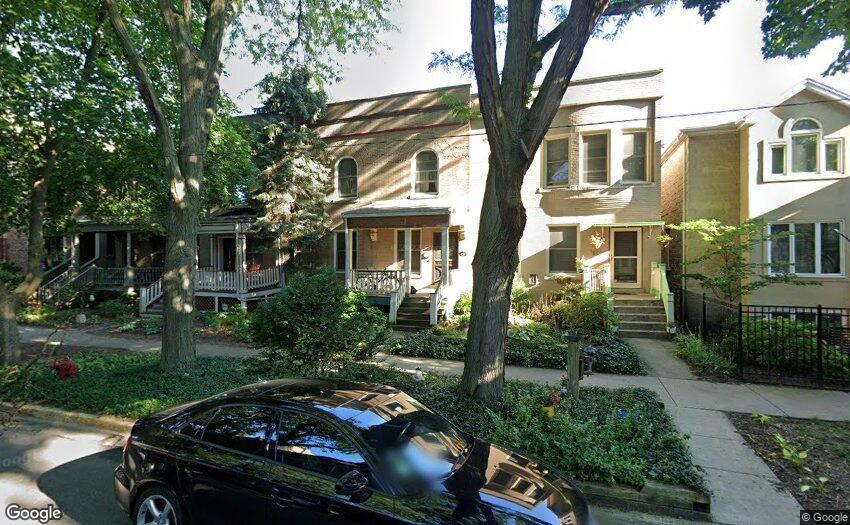 1824 W Eddy St, Chicago, IL 60657 - view of front facade featuring a porch, fence, and stairway