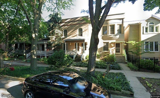 1824 W Eddy St, Chicago, IL 60657 - view of front facade featuring a porch, fence, and stairway