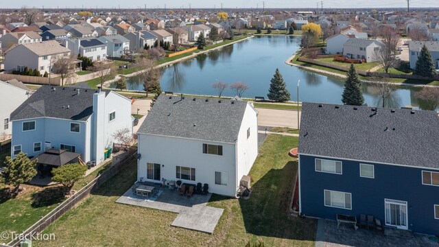 aerial perspective of suburban area with a large body of water