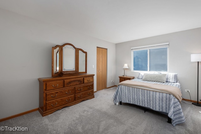 carpeted bedroom with baseboards