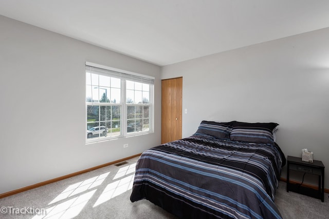 bedroom featuring carpet flooring and baseboards