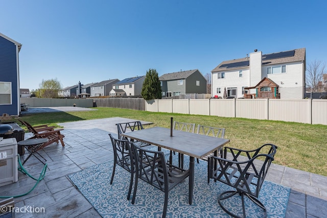 view of patio featuring a residential view and outdoor dining area