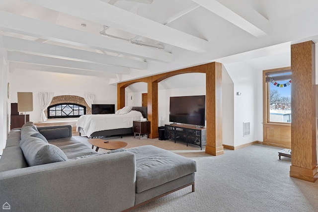 bedroom featuring visible vents, baseboards, lofted ceiling with beams, and carpet floors