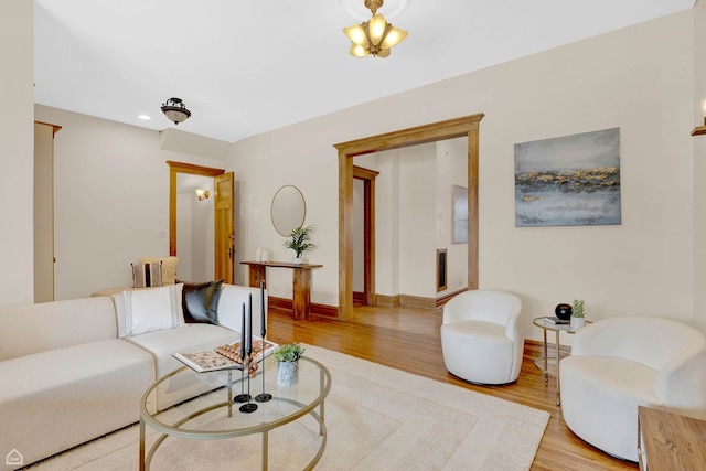living room with wood finished floors and baseboards