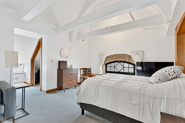 carpeted bedroom featuring baseboards and vaulted ceiling with beams
