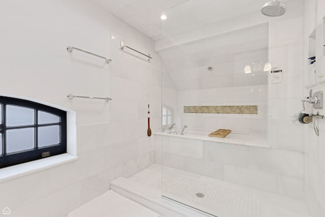 full bathroom with a tile shower