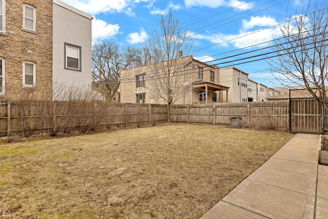 view of yard with a fenced backyard