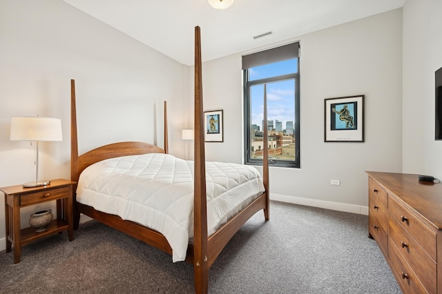 bedroom with carpet floors, baseboards, and visible vents