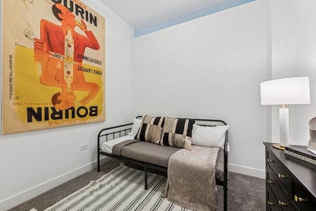 living area with baseboards and carpet