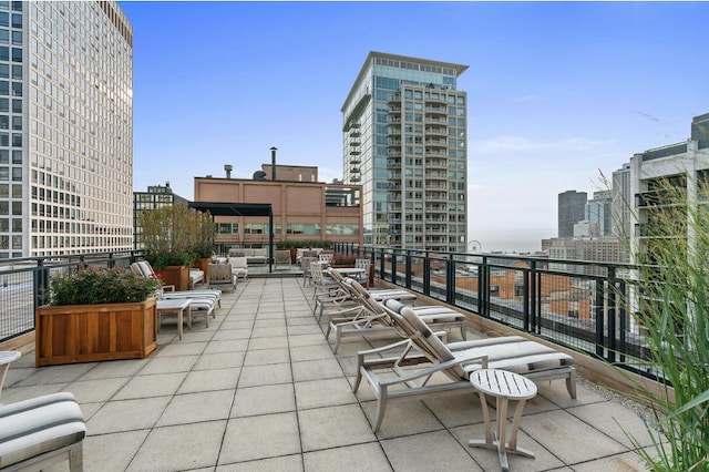 view of patio / terrace with a city view and an outdoor hangout area
