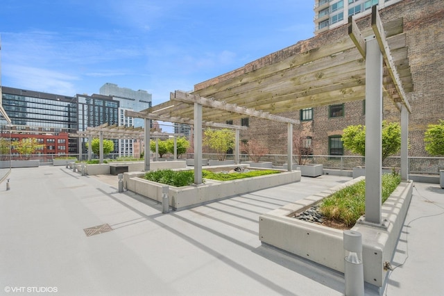 view of home's community with a pergola and a city view