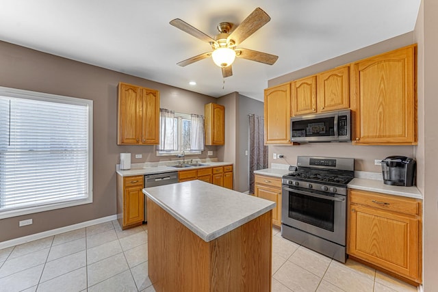 9163 Falcon Greens Dr, Lakewood, IL 60014 - kitchen featuring stainless steel appliances, a sink, light tile patterned flooring, ceiling fan, and recessed lighting