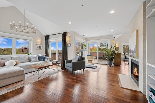 518 Winnetka Ave Unit 301, Winnetka, IL 60093 - living room featuring a fireplace, a notable chandelier, high vaulted ceiling, and wood finished floors